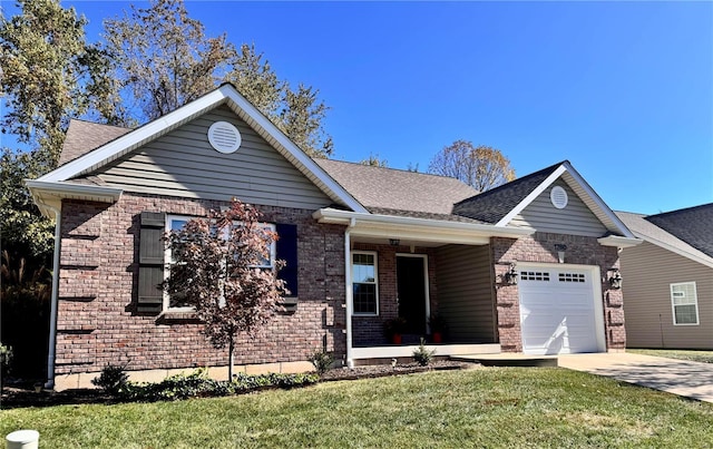 view of front of property with a garage and a front lawn