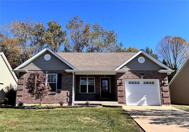 view of front of house featuring a garage and a front lawn