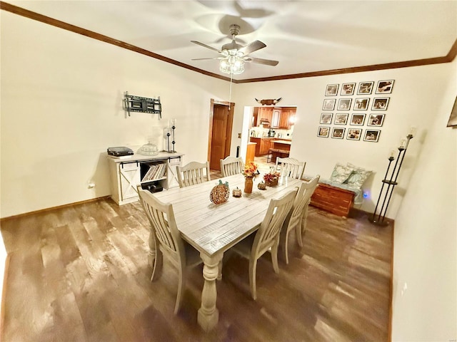 dining space with light hardwood / wood-style floors, crown molding, and ceiling fan