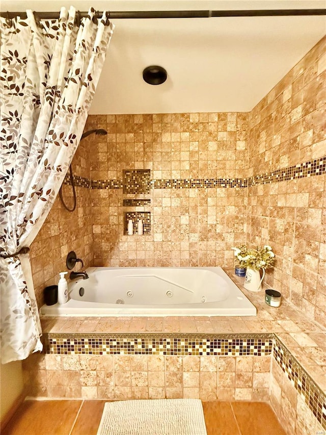 bathroom featuring tile patterned floors and separate shower and tub