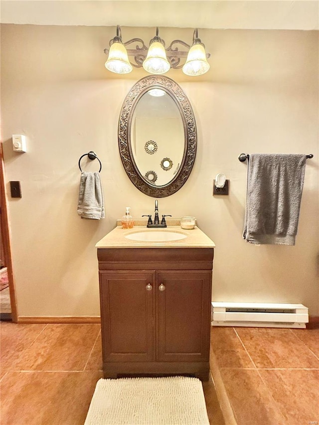 bathroom featuring vanity, tile patterned floors, and a baseboard heating unit