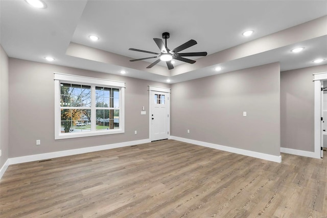 entrance foyer with ceiling fan and light wood-type flooring