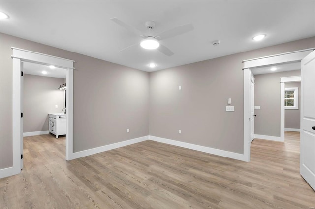 spare room with light hardwood / wood-style flooring and ceiling fan