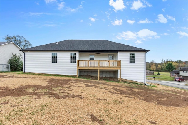 back of property with a wooden deck