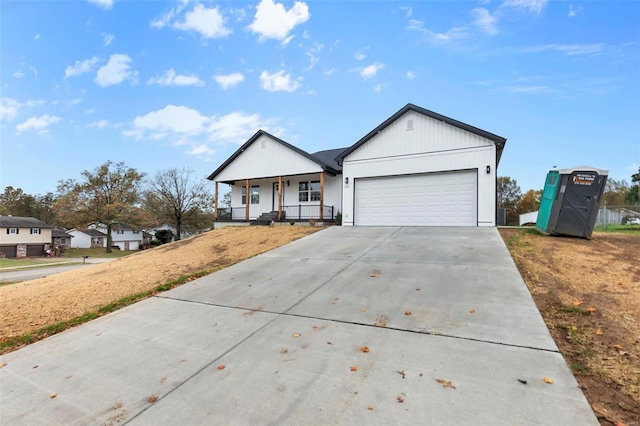 ranch-style house with a porch and a garage