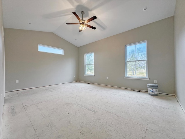 unfurnished room featuring lofted ceiling, a wealth of natural light, and ceiling fan