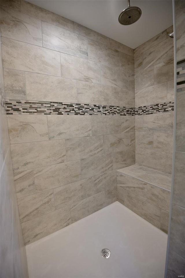 bathroom with tiled shower