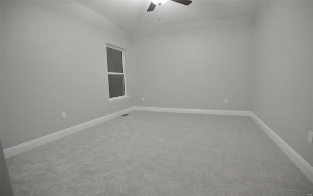 spare room featuring carpet flooring and ceiling fan