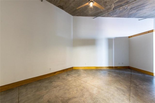 spare room with concrete flooring and ceiling fan