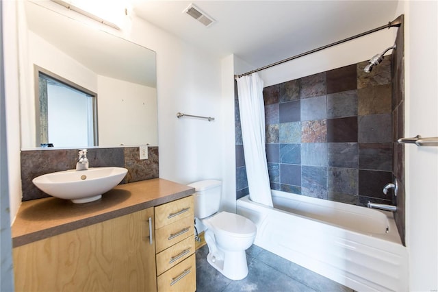 full bathroom featuring tasteful backsplash, tile patterned floors, toilet, vanity, and shower / tub combo