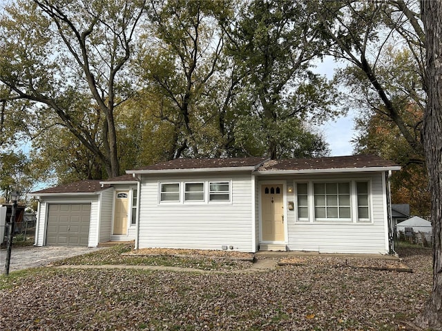 single story home with a garage