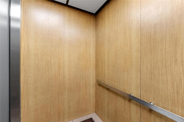 room details with elevator and wooden walls