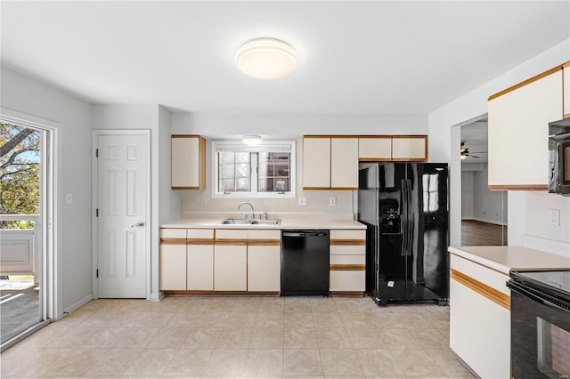 kitchen featuring tasteful backsplash, ceiling fan, sink, and black appliances