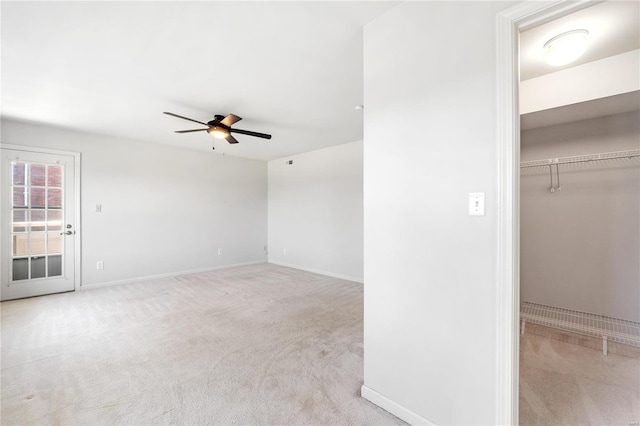 carpeted empty room with ceiling fan