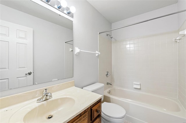 full bathroom featuring vanity, toilet, and tiled shower / bath