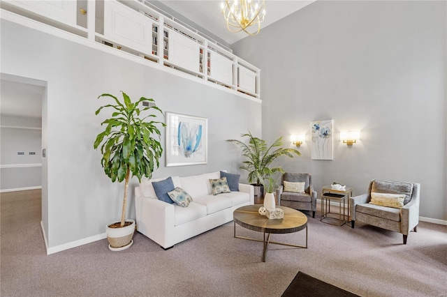 carpeted living room with a towering ceiling and a notable chandelier