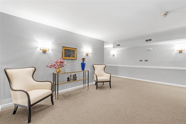 sitting room featuring carpet