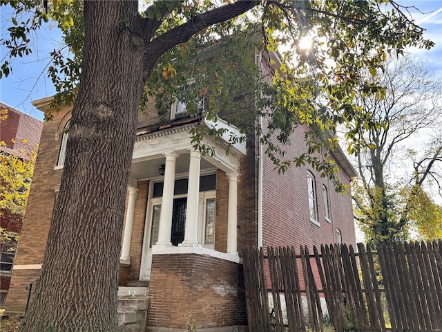 view of side of property with a porch