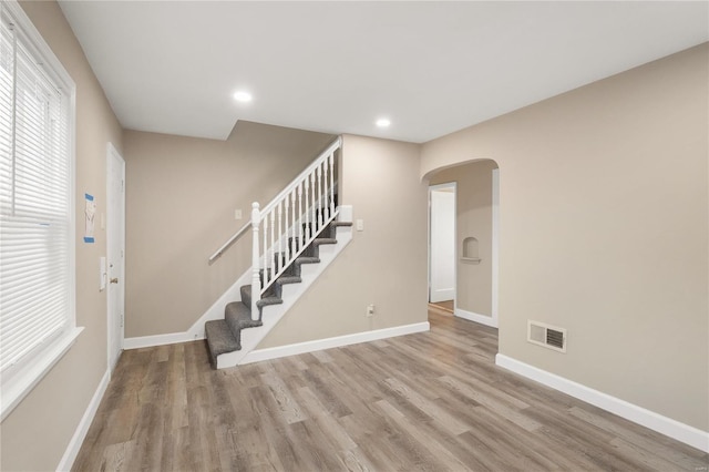 stairway featuring hardwood / wood-style flooring