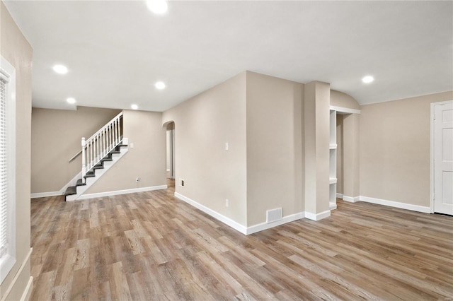 basement featuring light hardwood / wood-style floors