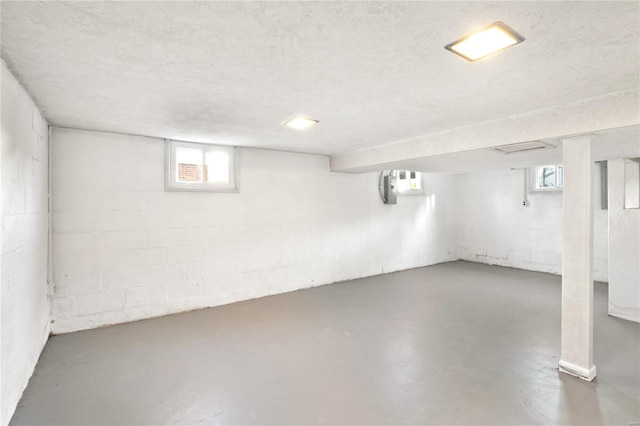 basement featuring a textured ceiling