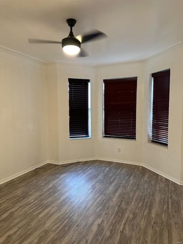 unfurnished room featuring ornamental molding, ceiling fan, and dark hardwood / wood-style flooring