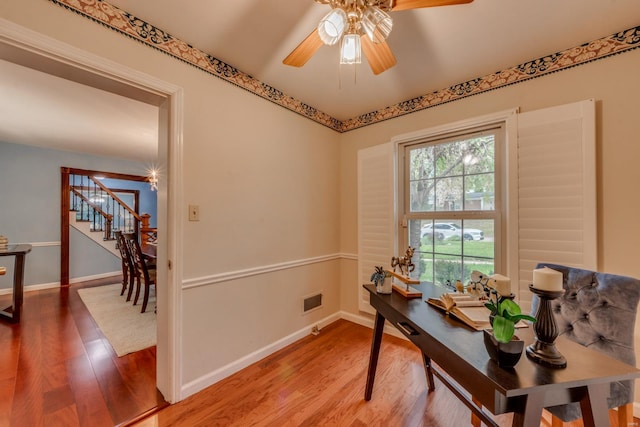 office area with ceiling fan and wood-type flooring