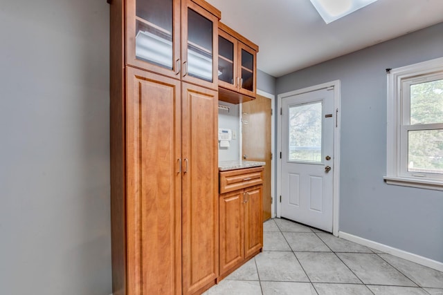 entryway featuring light tile patterned floors