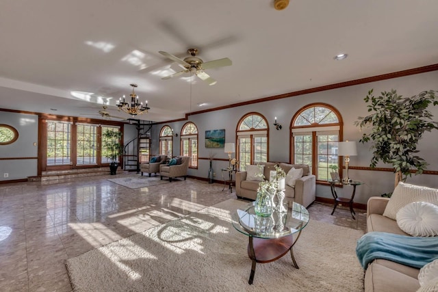 living room featuring ornamental molding and ceiling fan with notable chandelier