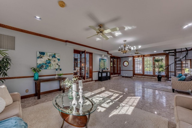 living room featuring ceiling fan with notable chandelier and crown molding