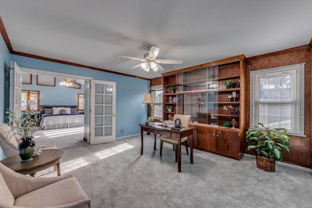 carpeted office space featuring a healthy amount of sunlight and crown molding