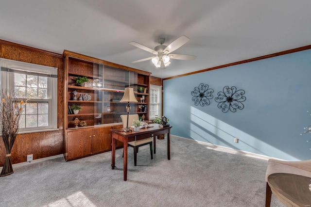 home office featuring ceiling fan, light colored carpet, and ornamental molding