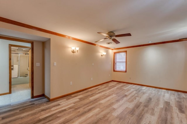 spare room featuring crown molding, ceiling fan, and light hardwood / wood-style flooring