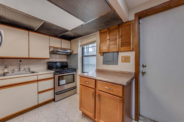 kitchen with decorative backsplash, stainless steel electric range oven, and sink