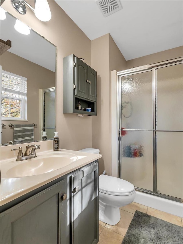 full bath featuring toilet, a stall shower, tile patterned floors, visible vents, and vanity