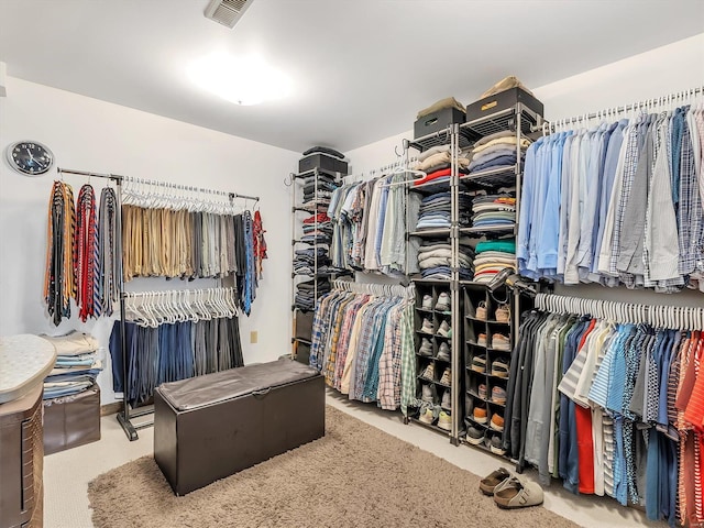 walk in closet featuring carpet and visible vents