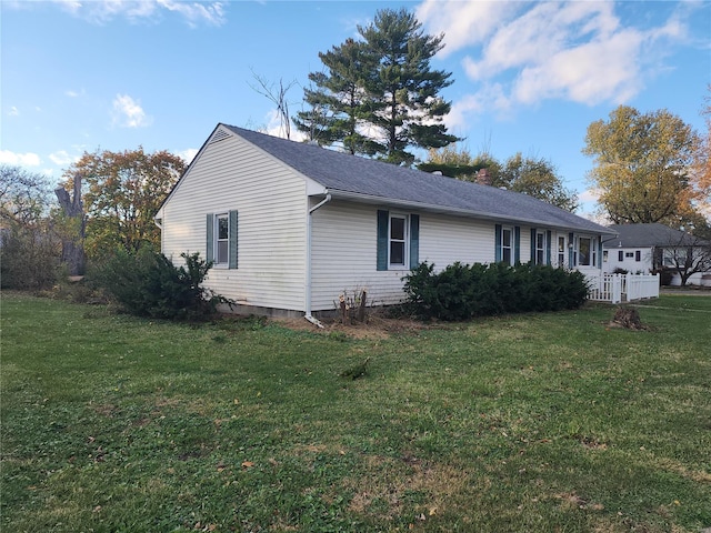 view of property exterior with a lawn