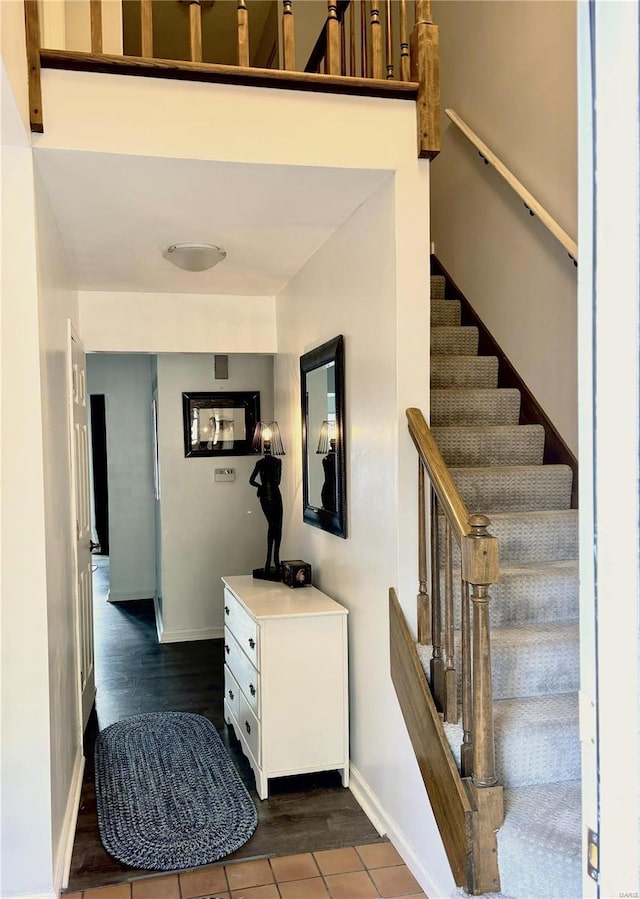 stairs featuring hardwood / wood-style flooring