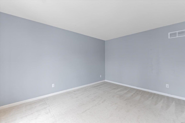 empty room featuring light colored carpet