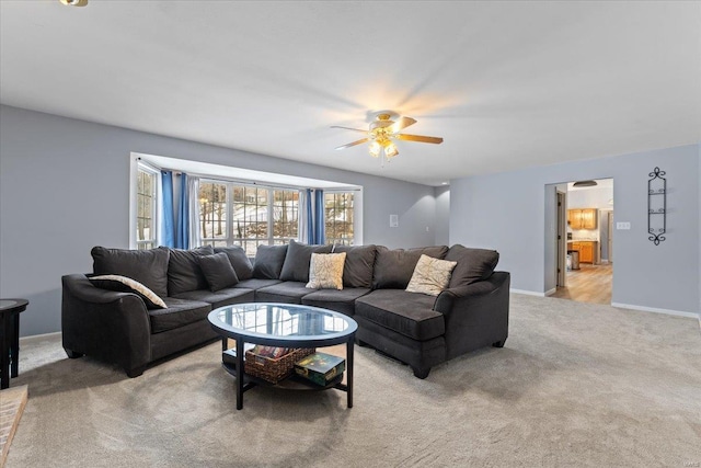 living room with light carpet and ceiling fan