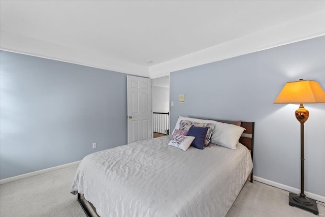 bedroom featuring light carpet