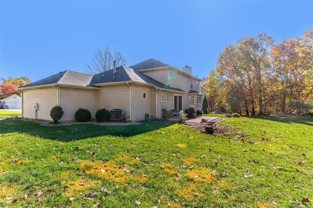 view of property exterior with central AC unit, a lawn, and a patio