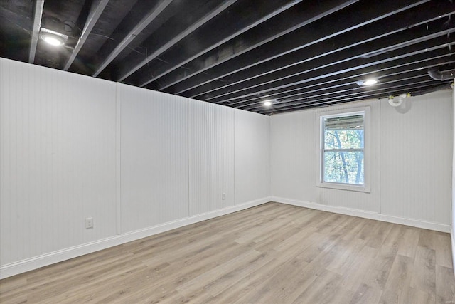 basement featuring wood-type flooring