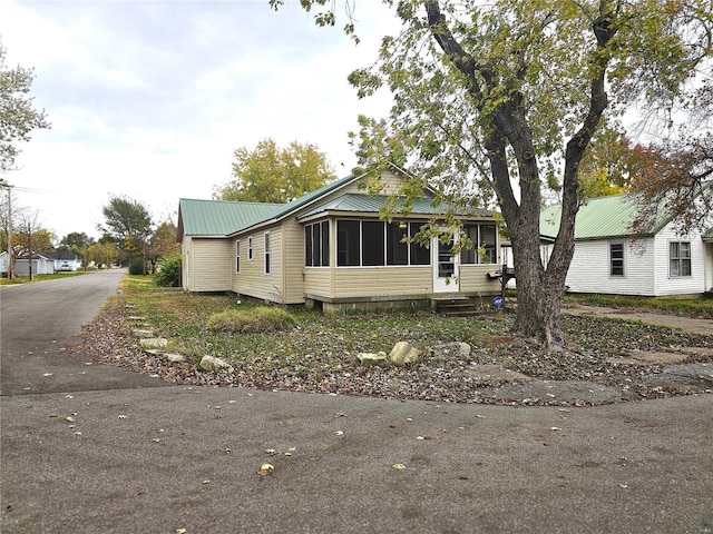 view of front of property featuring a sunroom