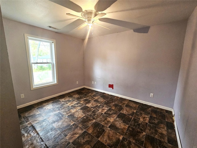 spare room featuring ceiling fan