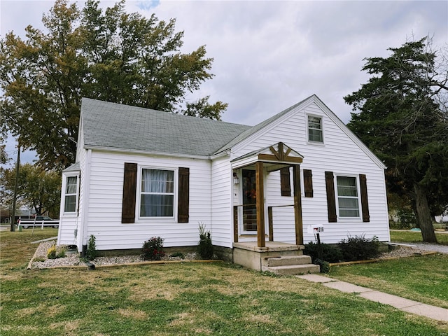 bungalow with a front yard