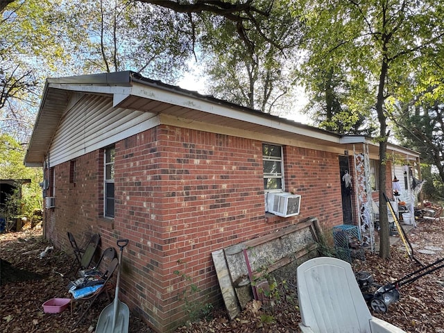 view of side of property with cooling unit