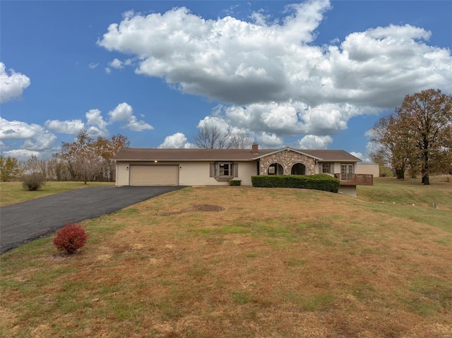 ranch-style house with a front yard and a garage