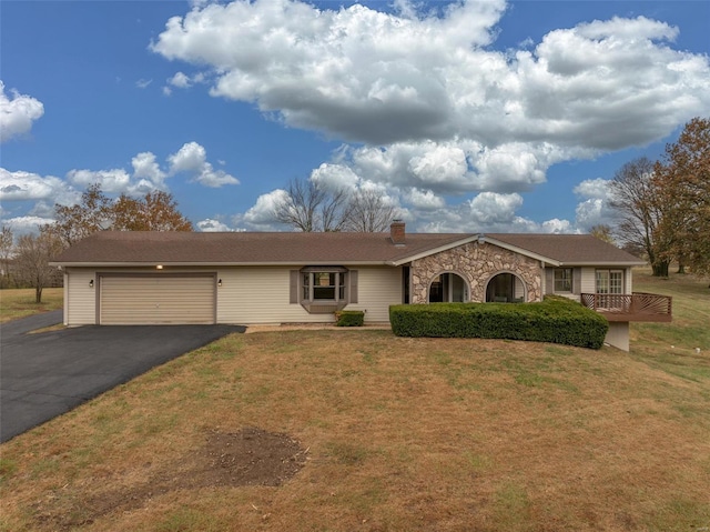 ranch-style house with a front lawn and a garage