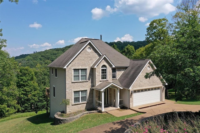 view of front facade with a garage and a front lawn